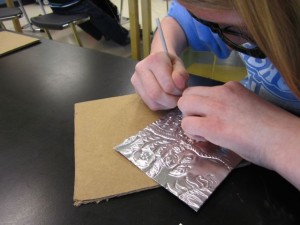 Embossing the metal foil